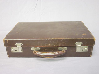 A brown leather attache case