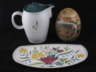A Denby green Wheat patterned jug 6", a Mid Winter floral  patterned boat shaped dish 11 1/2" and an Oriental style figure of  an egg 6"