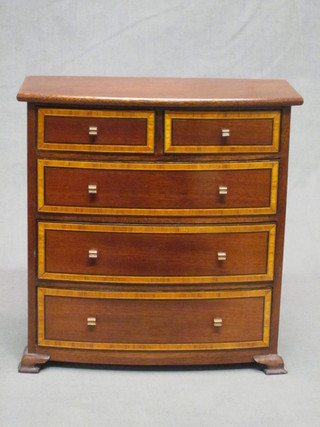 An Edwardian inlaid mahogany bow front "apprentice" chest of 2 short and 3 long drawers, raised on bracket feet 8"