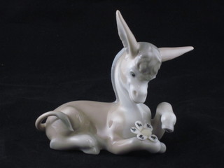 A Lladro figure of a seated Donkey 5"