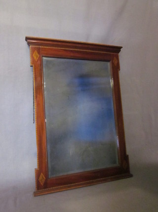 An Edwardian rectangular bevelled plate chimney mirror  contained in an inlaid mahogany frame 22"