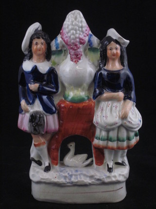A 19th Century Staffordshire flat back figure group of 2 standing  ladies with swan, 7", f and r,