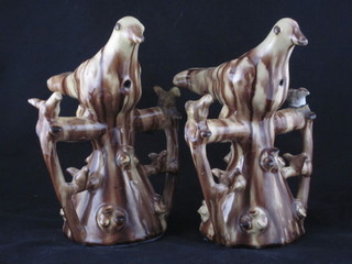 A pair of Wealden style pottery figures of birds incorporating  whistles, 7", f and r,  ILLUSTRATED