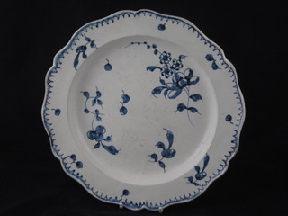 An 18th Century blue and white plate with floral decoration 9  1/2"