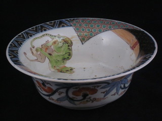 An Oriental circular porcelain bowl the body decorated cats and fish, the base with 4 character mark, crack to base, 10"