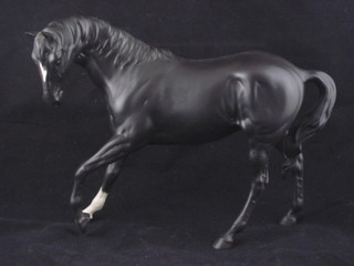 A Beswick figure of a standing black horse 7"