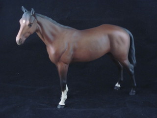 A Beswick figure of a bay horse 8"