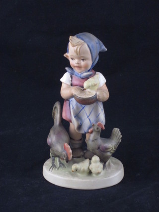 A Goebel figure of a girl with chickens 5"