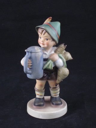 A Goebel figure of a boy with a basket and a large stein 5"