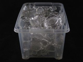 A large collection of various cut glass decanter stoppers