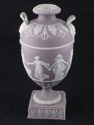 A Wedgwood pink Jasperware twin handled urn decorated  classical figures, raised on square base impressed Wedgwood 7",  handle f and r and base chipped,