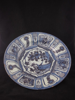 An 18th/19th Century circular Delft blue and white charger,  13", some chips  ILLUSTRATED