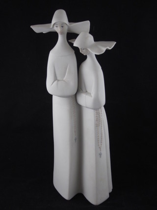 A Lladro figure of 2 standing nuns, base incised 16B 13"