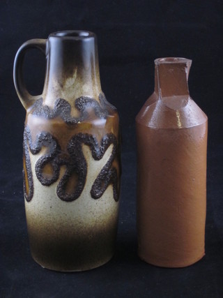 A Victorian salt glazed ink bottle 5 1/2" and a German Art  Pottery jug 6"