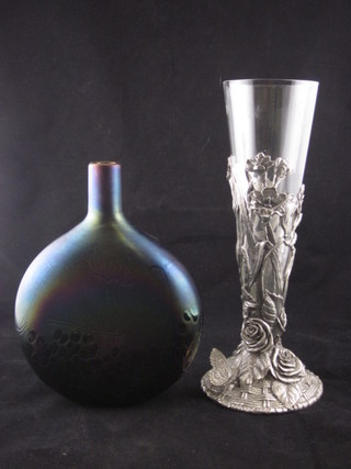 A purple Art Glass vase with vinery decoration, the base signed  8" and a glass vase contained in a pewter mount 10"