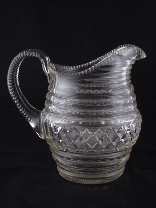 A Georgian circular cut glass jug 7"