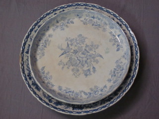 A 19th Century Wedgwood circular blue and white pottery dish  with floral decoration 12" together with a Booths blue and white  dish 14"