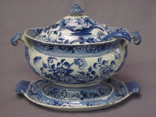 A handsome 19th Century blue and white twin handled tureen  and stand, the base marked Opaque China Riley complete with  ladle, lid f and r and chips to inner rim of tureen, 16"