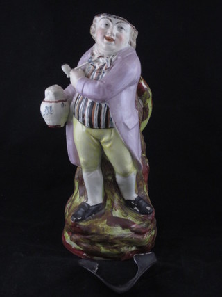 An 18th/19th Century Staffordshire Toby jug in the form of Toby Philpot with flagon of ale and pipe, 11"