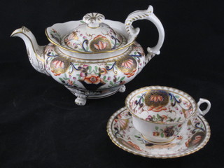 A 31 piece Derby style tea service comprising teapot, twin  handled sucrier and cover, slop bowl - cracked, cream jug, pair  of square twin handled dishes 8", circular plate 7 1/2", 12 cups -  2 cracked and 12 saucers - 1 cracked, together with a blue and  white tea bowl 3" and a crackle glazed figure of a seated owl 9"