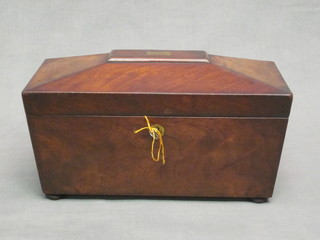 A 19th Century mahogany tea caddy of sarcophagus form with  hinged lid, 11"