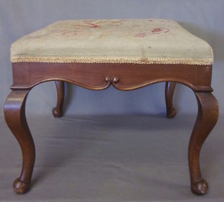 A rectangular walnut stool with Berlin woolwork seat, raised on cabriole supports 20"