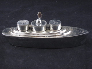 An Art Deco chromium plated 3 piece condiment in the form of  a yacht with salt, mustard and pepper pot, base marked RD  849865