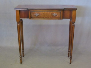 A Georgian style bow front mahogany side table, fitted a frieze drawer and raised on turned supports 29"