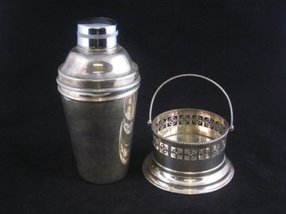 A silver plated cocktail shaker and a small circular dish with swing handle