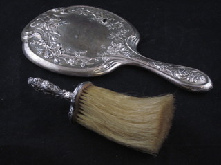 An embossed silver backed handmirror, some holes, together  with a silver heart shaped handled brush