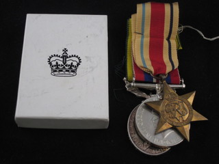 A group of 3 medals to 6205317 Gunner W J Humphrey, Royal Artillery comprising Africa Star, British War medal and  Territorial Efficiency medal together with cardboard carton for  Efficiency medal