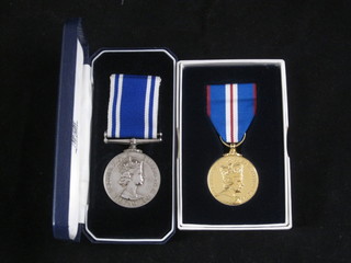 A pair of medals to Constable Philip J Bottomer comprising Queen's Golden Jubilee medal 2002 and Police Long Service  Good Conduct medal, boxed