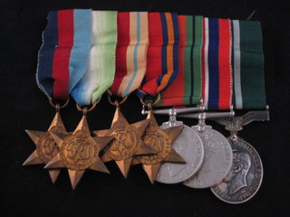 A group of 6 medals to Wing Commander E J Chandler RAF  Volunteer Reserve comprising 1939-45 Star, Atlantic Star, Africa  Star, Burma Star, Defence and War medal, George VI issue Air  Efficiency Award, named WC E J Chandler 750665 RAF VR