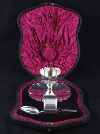 An Edwardian 3 piece silver christening set comprising egg cup, spoon and napkin ring, egg cup and spoon - London 1902,  napkin ring - Birmingham 1899, 3 ozs, contained in original  presentation case