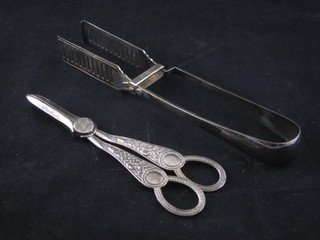A pair of silver plated grape scissors and a pair of silver plated asparagus tongs