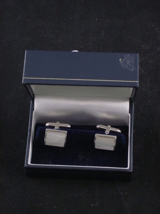 A pair of square silver and mother of pearl mounted cufflinks
