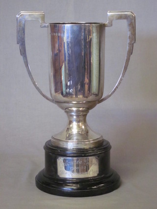 A large and impressive silver Art Deco twin handled trophy cup,  the base marked The Calcutta Races 1936-1937 - The Monsoon  Cup, London 1935 with Jubilee hallmark, approx 40 ozs   ILLUSTRATED FRONT COVER