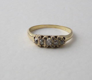 A lady's yellow gold dress ring set 5 diamonds