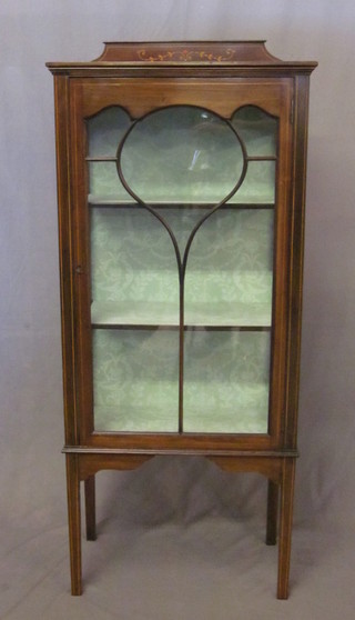 An Edwardian inlaid mahogany display cabinet, fitted adjustable  shelves enclosed by astragal glazed panelled doors, raised on  square feet 24"