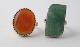A 9ct gold dress ring set a circular polished hardstone and 1 other dress ring set a rectangular green polished hardstone
