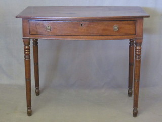 A Victorian mahogany bow front side table fitted a drawer,  raised on turned supports 36"