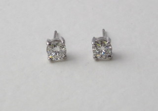 A pair of diamond stud earrings, approx 0.80ct