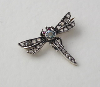 A lady's brooch in the form of a dragonfly, the body set  diamonds and having ruby eyes