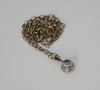 A gilt metal chain hung a white stone pendant