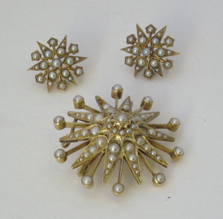 A Victorian gilt metal brooch set pearls and a pair of matching earrings, missing some stones,