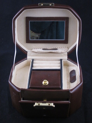 A lozenge shaped jewellery box with hinged lid