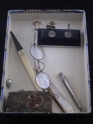 A 19th Century rectangular snuff box, a pair of antique spectacles, a carved mother of pearl letter opener and other minor  curios