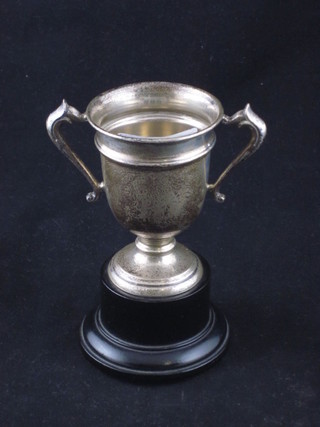 A silver twin handled trophy cup, London 1925, 1 oz