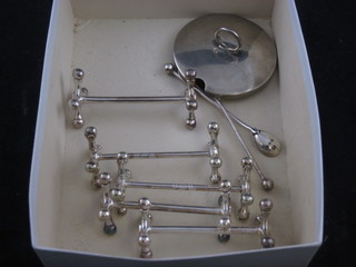 A silver preserve jar lid, 2 silver mustard spoons and 5 silver plated knife rests