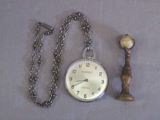 An Ingasol open faced dress pocket watch contained in a stainless steel case, together with a gilt metal seal in the form of a  clenched claw